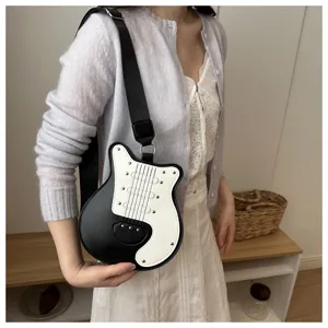 Guitar shaped crossbody bag for women, black white color block with metal rivets for daily wear.
