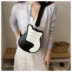 Black white colorblock guitar shape crossbody bag with rivets and wide strap for women.