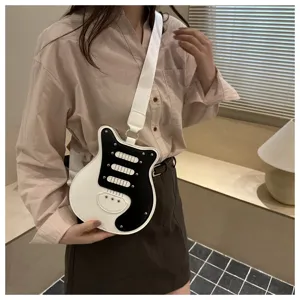 Unique guitar shaped crossbody bag with black white color block and metal rivets for women.
