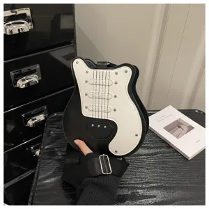 Guitar shaped crossbody bag for women, creative black and white shoulder bag with studs.