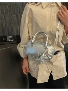 Silver metallic Boston handbag, casual PU leather bowling crossbody bag with star charm and key.