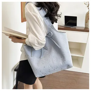 Light blue star print canvas tote bag detail, featuring casual shoulder straps and a cute bow.
