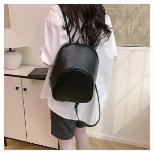 Women small black leather backpack casual daypack for daily commute and outdoor travel.