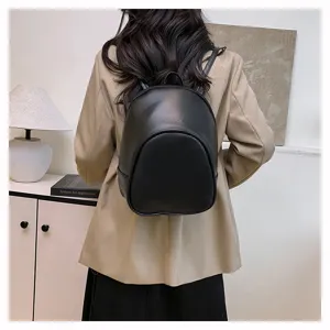 Black minimalist casual backpack for women, stylish small daily commuting travel school bag.