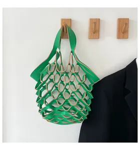 Green leather mesh tote bag for women, stylish minimalist hollow design casual handbag.