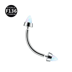 Titanium curved barbell piercing jewelry with opal spike ends for body art and cartilage use.