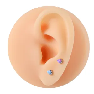 Titanium cartilage piercing studs with synthetic opal stones, designed for body piercing use.