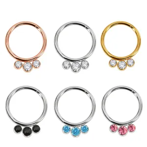 Stainless steel piercing nose ring set featuring sparkling three crystal stones in various colors.