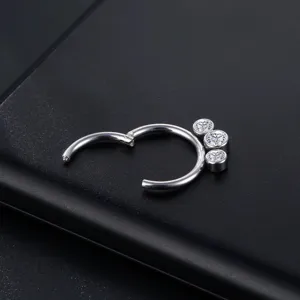Stainless steel piercing body jewelry close up detail shot showing clear stone settings.