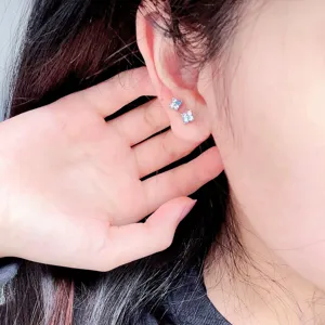 Detailed view of F136 titanium gradient zircon flower piercing stud earring for women.