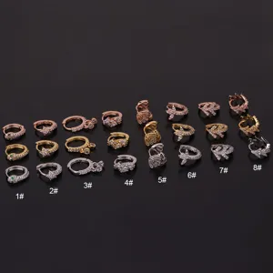 Close-up detail shot of stainless steel cubic zirconia hoop earrings with diverse cute motifs.