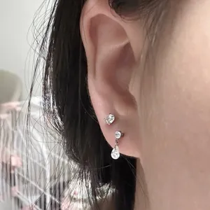 F136 titanium zircon ear piercing studs featuring round and teardrop dangle design for daily wear.