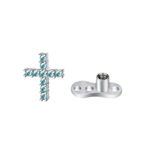 Gioiello per piercing microdermale in acciaio con top a croce in zircone azzurro scintillante.