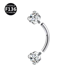 Detail view of F136 titanium curved barbell piercing jewelry with sparkling zircon stones.