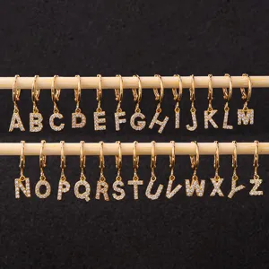 Detailed close-up view of 26 alphabet letter hoop earrings, paved with sparkling cubic zirconia.