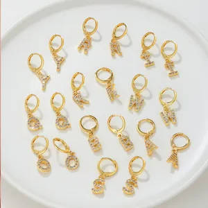 Pavé crystal letter hoop earrings, stylish gold-plated stainless steel huggie earrings.