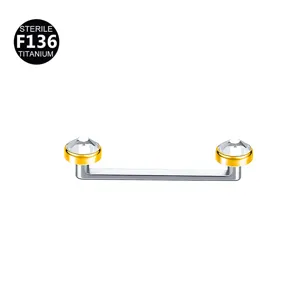 Detail shot of F136 titanium surface piercing barbell featuring dual clear crystal bezels.