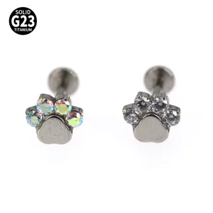 Cat paw labret piercing detail, G23 titanium body jewelry with sparkling zirconia stones.