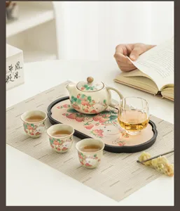 Detailed view of cute strawberry rabbit ceramic kung fu tea set, exquisite tabletop detail.