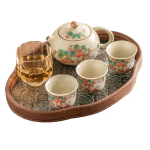 Ceramic kung fu tea set with cute strawberry rabbit pattern, elegant teapot and cups.