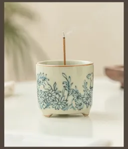 Ceramic incense burner with cute rabbit and flower pattern, detailed shot for home decor.