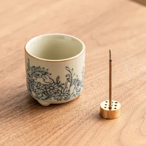 Ceramic incense burner and holder set with cute rabbit and flower pattern for home decor.