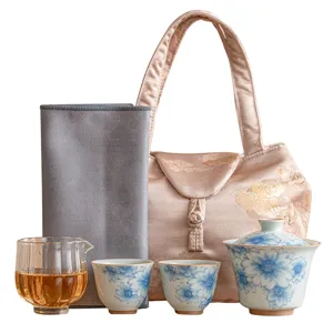 Blue and white ceramic kung fu tea set with gaiwan, teacups, glass fair cup, and stylish bag.