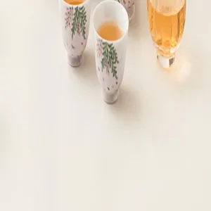 Handcrafted ceramic tea cups set with delicate floral patterns for traditional tea tasting.