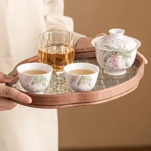 Hand-painted wisteria kung fu tea set with gaiwan cups and glass wooden tray for home use.