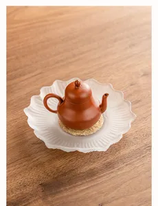Detailed view of the frosted lotus flower ceramic teapot tray, perfect for dry tea brewing.