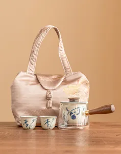 Travel tea set with glass teapot, two ceramic cups and portable storage bag for outdoor