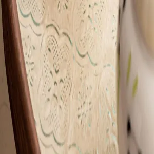 Detailed view of ceramic incense holder featuring classic clover pattern with wooden frame.