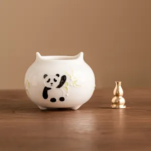 Hand-painted ceramic panda incense burner holder with brass gourd for home tea ceremony use.