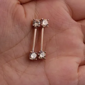 Rose gold straight barbell nipple rings with sparkling zirconia stones, perfect body piercing jewelry.