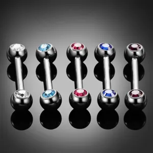 Detailed view of 5 colorful CZ barbell body piercing jewelry pieces with studio backdrop.