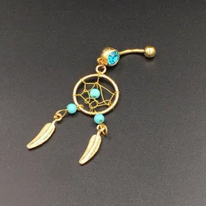 Gold tone dreamcatcher belly button ring with blue crystal and feather charms body piercing jewelry.