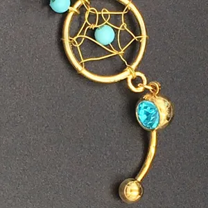 Gold dreamcatcher navel ring with blue crystal beads body piercing jewelry for women.
