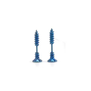 Close-up detail shot of unique blue screw-shaped piercing earrings, metallic finish body jewelry