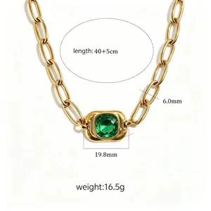 Chunky gold-tone titanium steel chain necklace featuring a square green gemstone pendant.