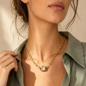 Close-up of a stylish gold titanium steel square gemstone clavicle chain necklace.