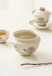 Hand-painted magnolia ceramic tea wash cup, detailed view of Chinese Kung Fu tea accessory.