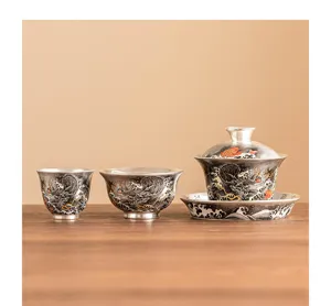 Silver plated tea set with gaiwan and cups, traditional dragon pattern for kung fu tea.