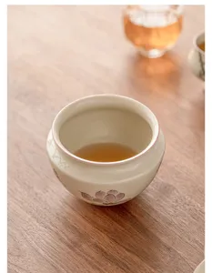 Hand-painted ceramic tea wash detail showing exquisite floral motif and smooth glaze texture.