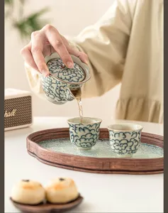 Ceramic teapot and tea cups set detail, elegant cloud pattern design for home kung fu tea.