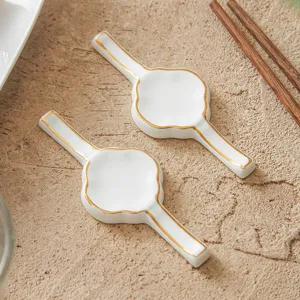 White ceramic chopstick rest with gold rim elegant tableware holder for dining table setup