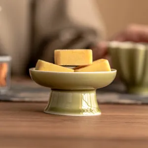 Green ceramic high footed tea cover rest and snack dish for kung fu tea ceremony home use