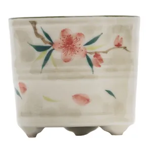 Bruciatore di incenso in ceramica dipinta a mano con fiori di pesco, base decorativa.