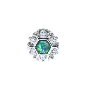 Vista detallada del expansor de acero con diseño de copo de nieve, ópalo y cristales.