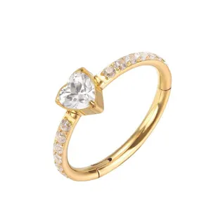 Close-up detail of G23 titanium heart-shaped zircon piercing ring, hinged segment clicker design.