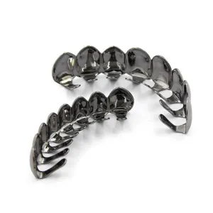 Detailed view of metal hip hop grillz top and bottom teeth set for fashion body jewelry.